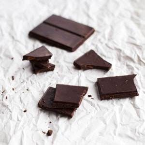 Chocolate chunks on a piece of paper.