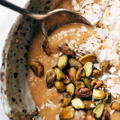 Carrot Cake Smoothie Bowl with coconut and pistachios.