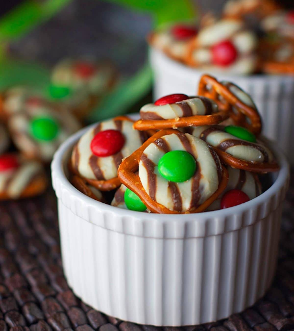 Holiday pretzel bites in a white dish.